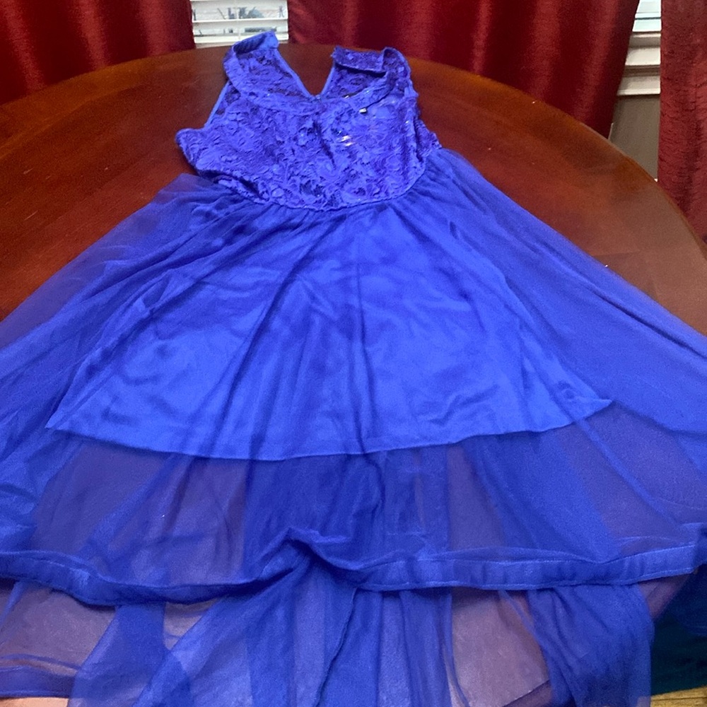 Sleeveless royal blue high-low dress.